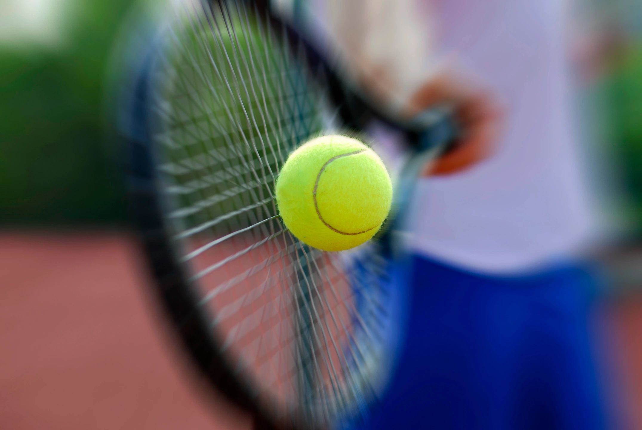 Tennis ball being hit